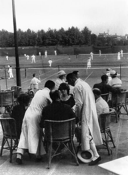 SHANGHAI: TENNIS CLUB. Wealthy foreigners are waited on by Chinese servants at