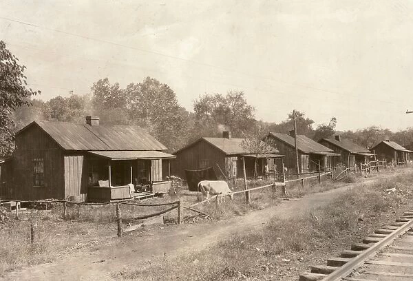 SHANTYTOWN, 1921. Row of coal miners shanties along Elk River at Bream, West Virginia