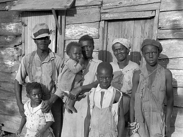 SHARECROPPER, 1936. Lewis Hunter and his family outside their home at Ladys Island
