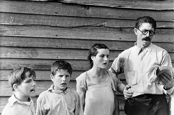 SHARECROPPER, c1935. A sharecropper and family singing hymns on the Sabbath, near Hale County