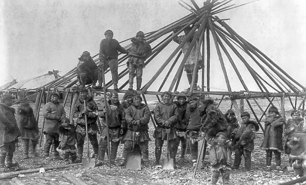 SIBERIA: ESKIMOS, c1897. A group of Eskimo men building a house in East Cape, Siberia