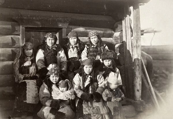 SIBERIA: TATARS, c1885. A Tatar women and children outside of their home in Siberia