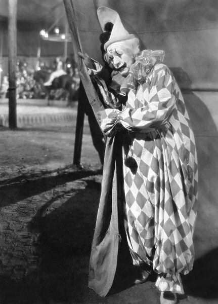 SILENT FILM STILL: CLOWN. A harlequin clown. Still from the motion picture 4 Devils, directed by F. W. Murnau, 1928