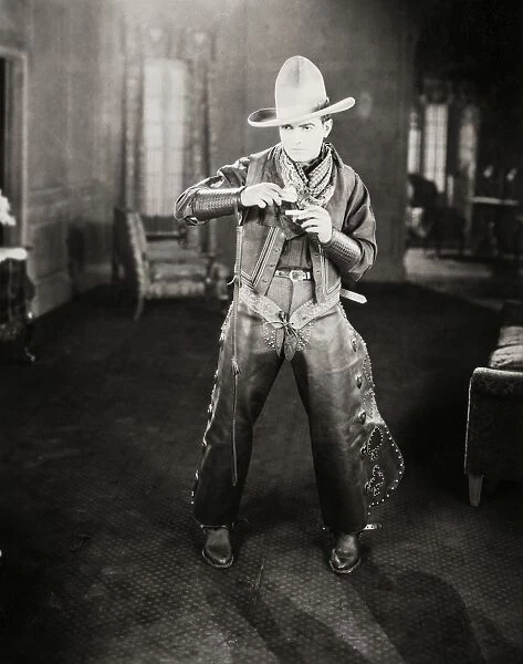 SILENT FILM STILL: COWBOYS. American actor Richard Barthelmess (1895-1963) portraying a cowboy in a silent film, c1926