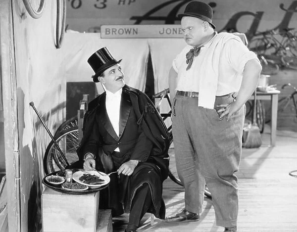 SILENT FILM STILL: EATING. Raymond Griffith and Charles H. Puffy