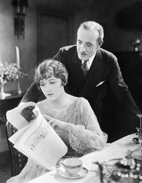 SILENT FILM STILL: READING. Anna Q. Nilsson and Lewis Stone in The Talker, 1925