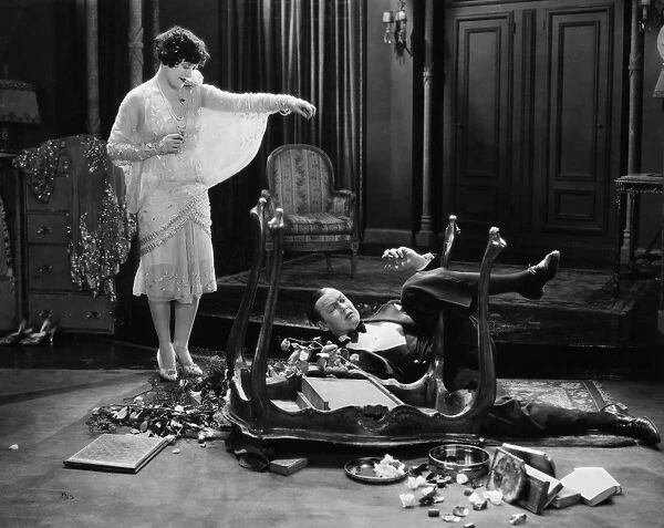 SILENT MOVIE STILL, 1920s. Still from a silent film showing a couple involved in a slapstick accident