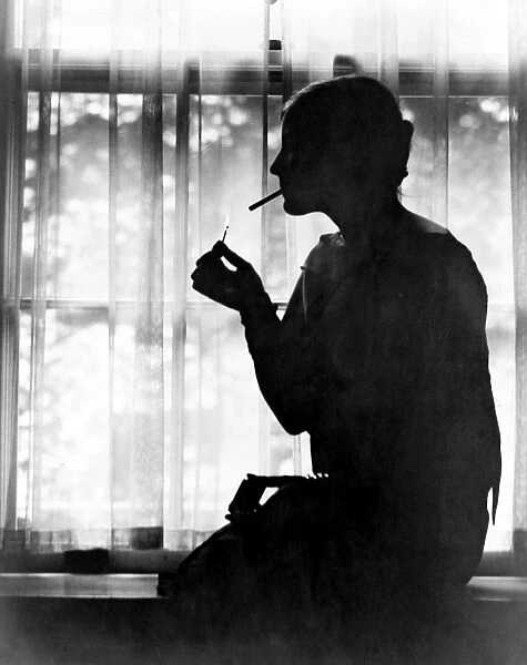 SILHOUETTE, c1925. Debutante Miss Ester Cochran in silhouette. Photograph, c1925