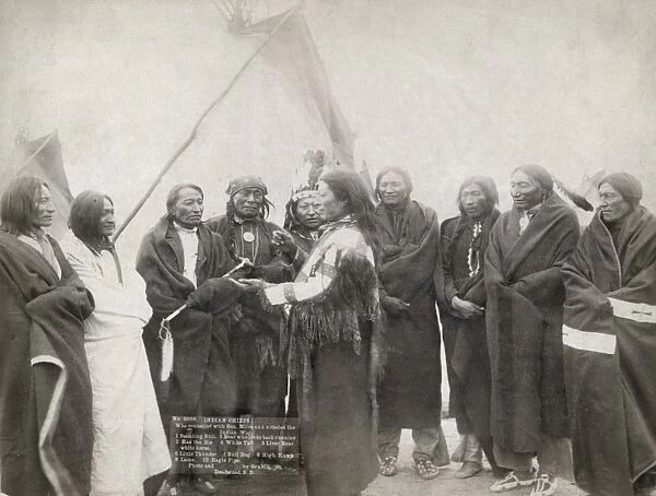 SIOUX CHIEFS, 1891. Group portrait of Lakota Sioux chiefs standing in front of a tipi