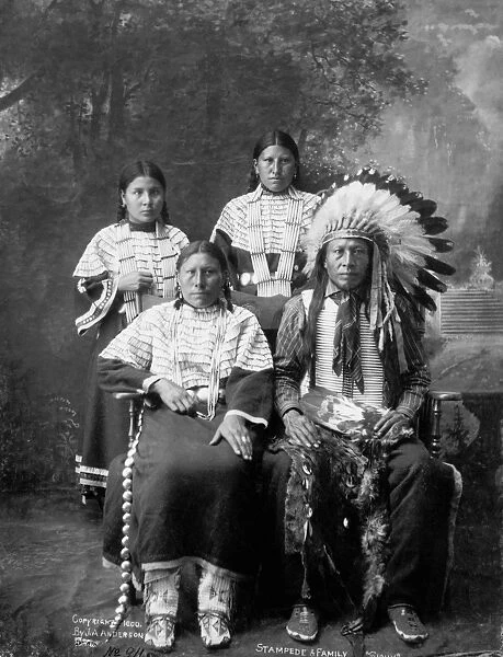 SIOUX FAMILY, c1910. A Sioux family. Photograph by J. A. Anderson, c1910