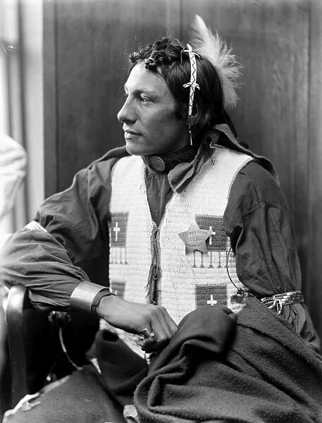 SIOUX NATIVE AMERICAN, c1900. An unidentified Sioux, a member of Buffalo Bills Wild West Show