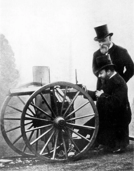 SIR HIRAM STEVENS MAXIM (1840-1916). American (naturalized British) inventor. Albert Edward, Prince of Wales (the future King Edward VII) firing a Maxim Gun while its inventor looks on, c1900