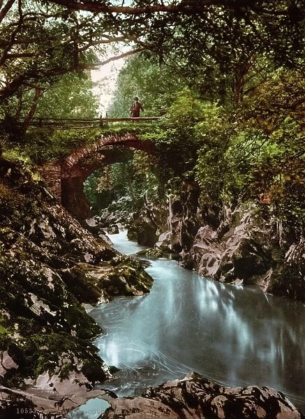 SNOWDONIA NATIONAL PARK. View of Roman bridge I, Betws-y-Coed (Prayer house in the wood) in a valley where the River Conwy is joined by the River Llugwy and the River Lledr in Snowdonia National Park, Wales. Photochrome print, c1890-1900