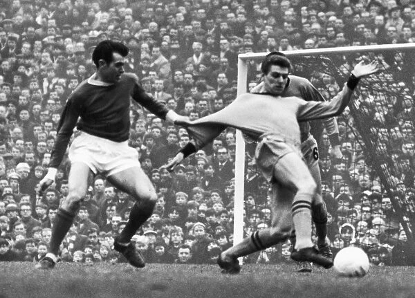 SOCCER MATCH, c1965. John Connelly of Manchester United soccer team pulls the uniform of an opponent during a match, c1965