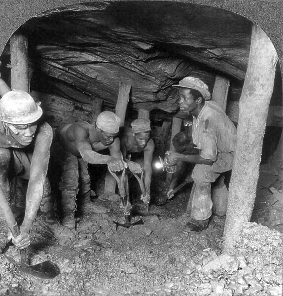 SOUTH AFRICA: GOLD MINERS. Five gold miners following the compressed air drill in the Crown Mine