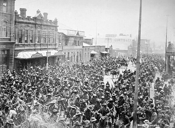 SOUTH AFRICA: RAID, 1896. Armed and mounted Boer Commandos moving through Johannesburg