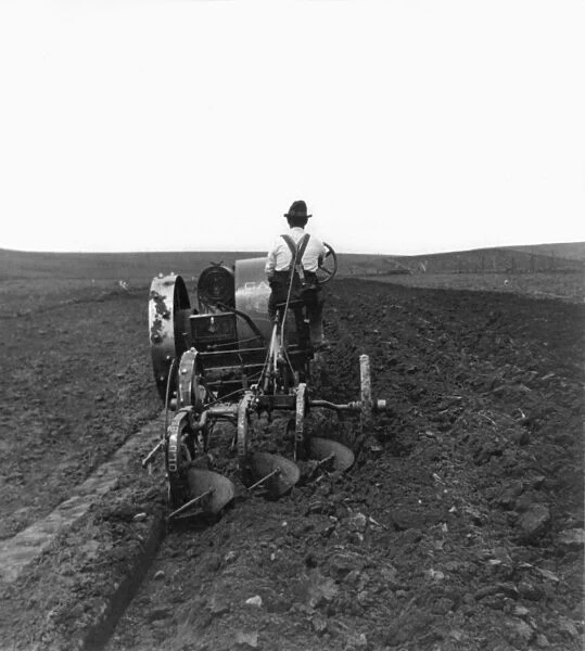 SOUTH DAKOTA: FARMING. A farmer plowing a field on the South Dakota prairie. Stereograph