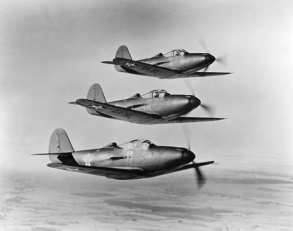 A squadron of Bell P-39 Airacobra fighter planes of the Army Air Corps flying in formation during World War II