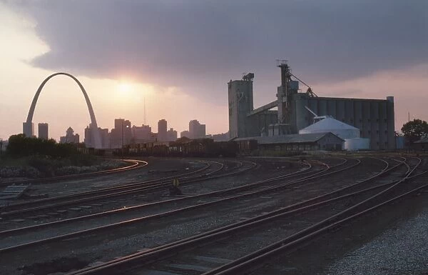 ST. LOUIS: FREIGHT YARD. Twilight view of a freight yard near a grain storage facility in St. Louis, Missouri. Photographed c1974