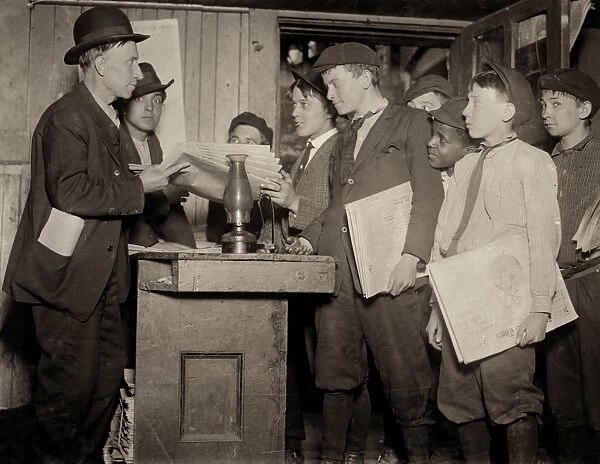 ST. LOUIS: NEWSBOYS, 1910. Boys receiving newspapers at the Burns Basement Branch