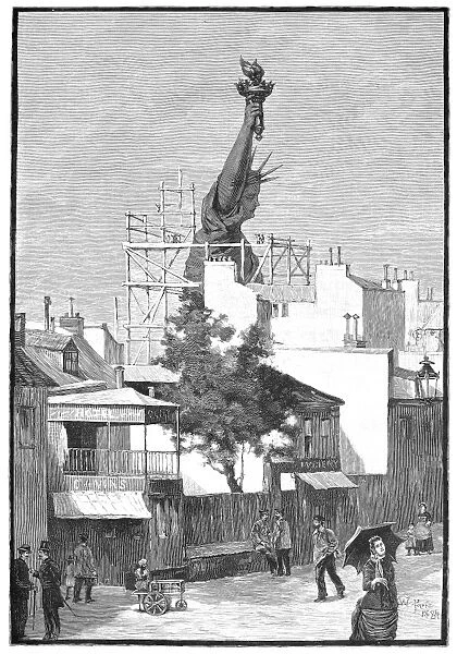 STATUE OF LIBERTY, 1884. Beginning the work of removing the Statue of Liberty from its construction site in Paris, France. Wood engraving, American, 1884