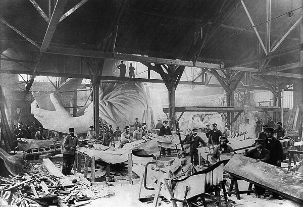 STATUE OF LIBERTY, c1882. Workmen constructing the Statue of Liberty in Bartholdis Parisian warehouse workshop. This was the first model, here showing the left hand and a quarter-size head. Photograph, c1882