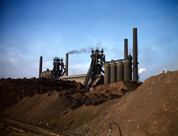 STEEL MILL, 1941. Blast furnace and iron ore at the Carnegie-Illinois Steel Corporation