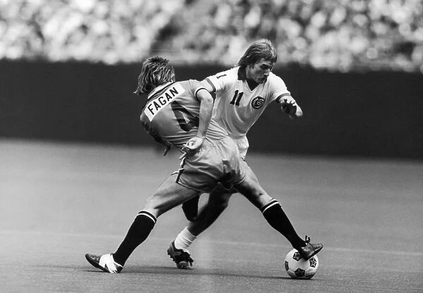 STEPHEN HUNT (1956- ). English soccer player. Hunt (right) playing for the New York Cosmos, battles Bernie Fagan of the Los Angeles Aztecs during a match, c1977