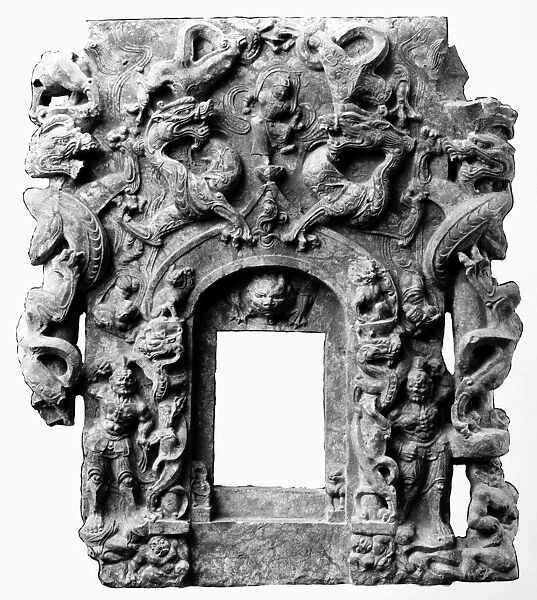 Stone relief work from the front of a Buddhist shrine, depicting dragons, lions, and guardians. Height: 27 1  /  4 in. T ang Dynasty, 7th-8th century