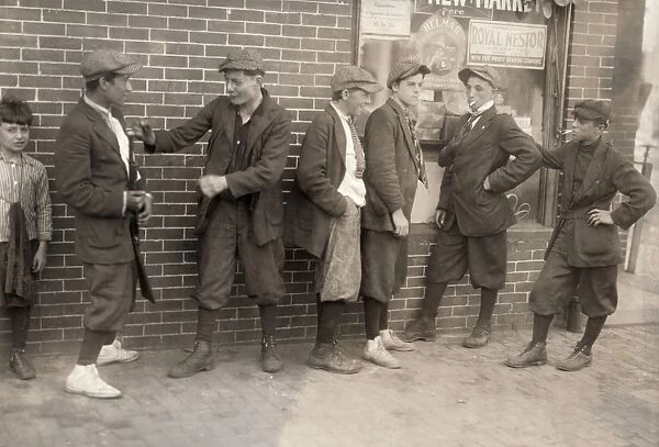 STREET GANG, 1916. Street gang of boys on the corner of Margaret and Water Streets