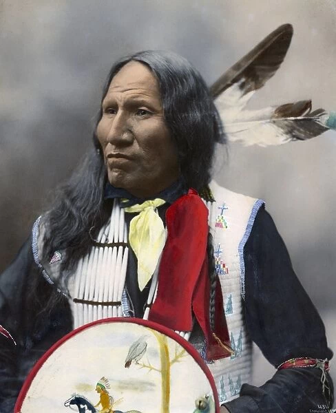 STRIKES WITH NOSE, c1899. Oglala Sioux chief. Hand colored platinum print photograph