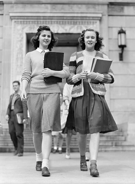 Students coming out of the library at Iowa State College. Ames, Iowa. Photograph by Jack Delano, May 1942