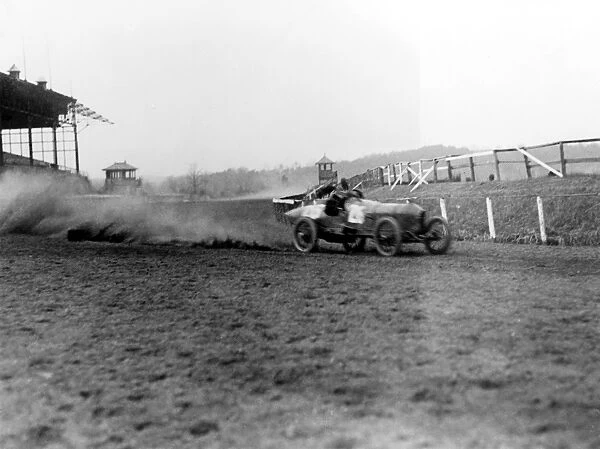 STUTZ RACECAR, 1916. A Stutz Weightman Special racecar going around a turn at the