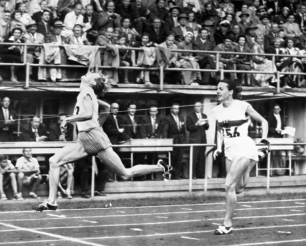 SUMMER OLYMPICS, 1952. Fanny Blankers-Koen of the Netherlands beating Marga Petersen of Germany in the 11th heat of the 100 meter dash event in the 1952 Summer Olympics in Helsinki, Finland