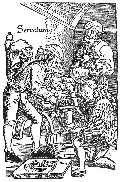 Surgeon performing an amputation. Woodcut from an edition of Hans von Gersdoffs Feldtbuch der Wundartzney, Strassburg, 1540