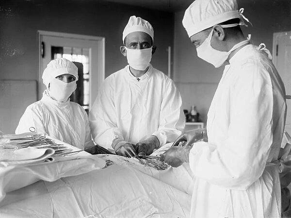 SURGERY, 1922. Surgeons at work. Photograph, 1922