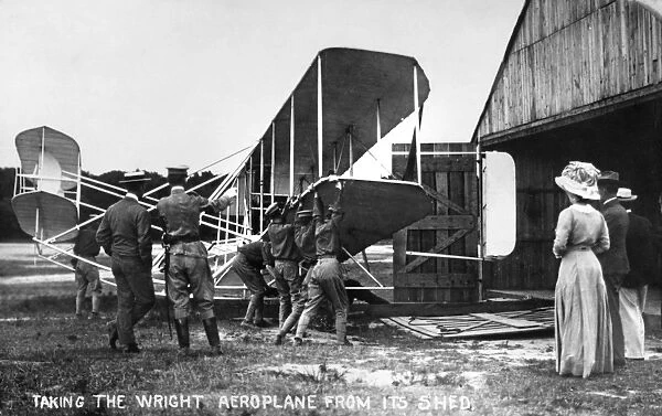 Taking the Wright Aeroplane from its Shed. Photograph, c1908