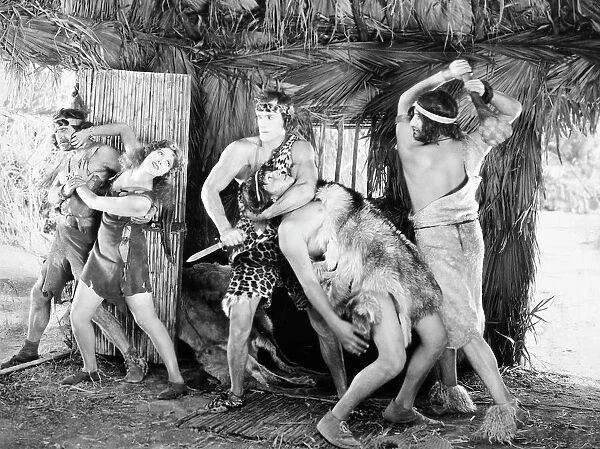 TARZAN THE MIGHTY, 1928. Frank Merrill in the title role and Natalie Kingston in Tarzan the Mighty, 1928