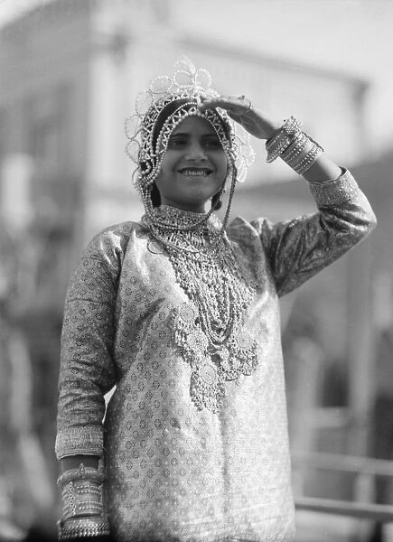 TEL AVIV: PURIM FESTIVAL. A young woman from Yemen representing Queen Esther at