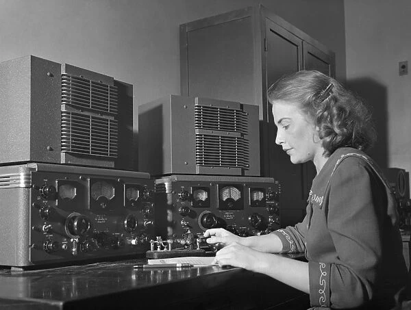 TELEGRAPH, c1943. A woman operating a telegraph. Photograph, c1943