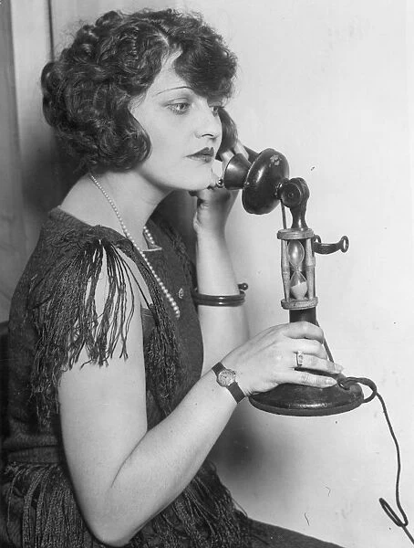 TELEPHONE CALL, 1920s. A still from a silent movie, American, 1920s
