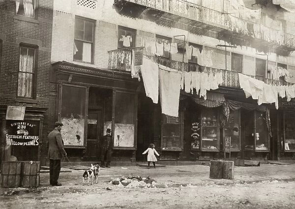 TENEMENT BUILDING, 1912. A tenement building in need of repair with eight families