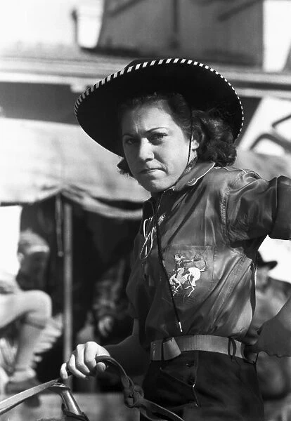 TEXAS: COWGIRL, 1940. Female rodeo performer at San Angelo Fat Stock Show, San Angelo, Texas. Photograph by Russell Lee, March 1940