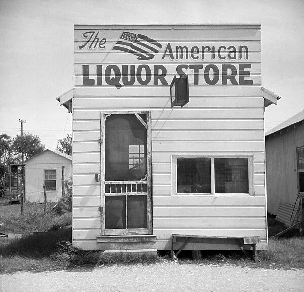 TEXAS: LIQUOR STORE. View of a liquor store in Palacios, Texas. Photograph by John Vachon