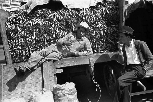 TEXAS: PEDDLER, 1939. A vendor with a truck load of carrots at a market in San Antonio, Texas