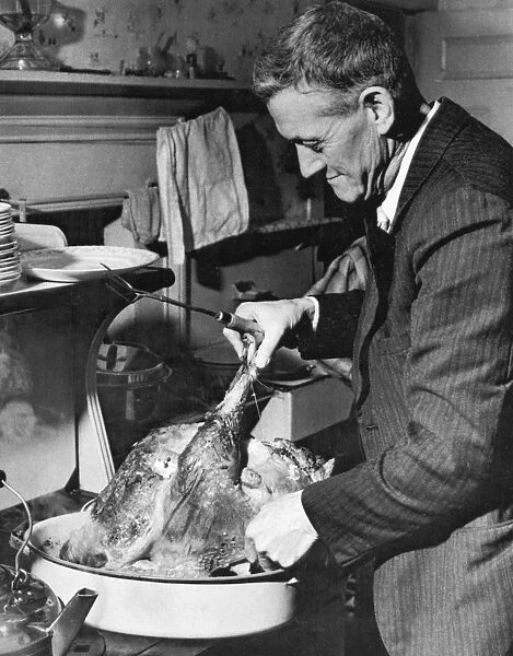 THANKSGIVING, 1940. Thanksgiving meal in Ledyard, Connecticut. Photographed 1940 by Jack Delano