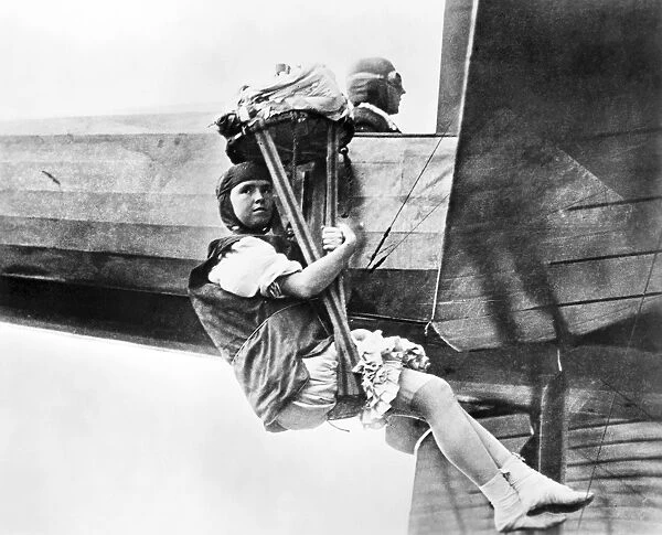 Tiny Broadwick suspended from a plane piloted by Glenn L. Martin, 1913