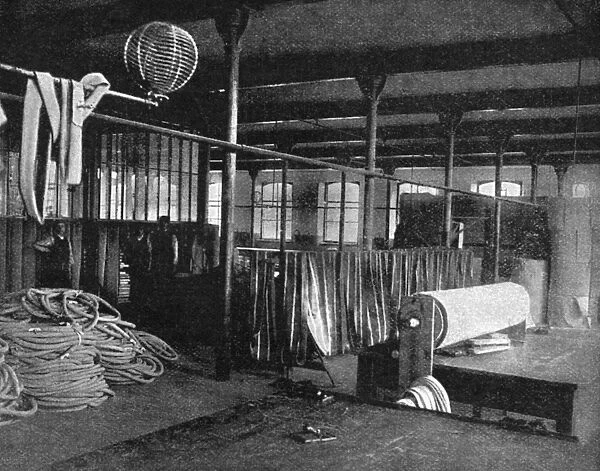 TIRE FACTORY, 1897. Canvas-cutting machinery at the Beeston pneumatic tire factory in England