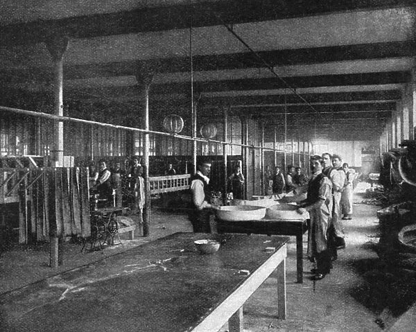 TIRE FACTORY, 1897. Workers at a wiring station at the Beeston pneumatic tire factory in England