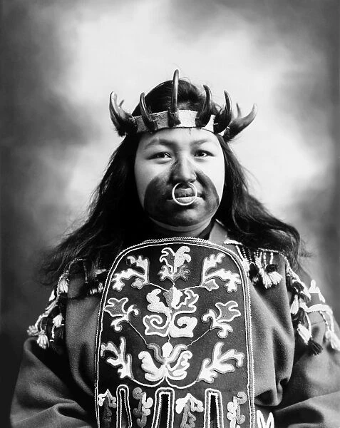 TLINGIT NATIVE AMERICAN, c1906. Kaw-Claa, a Tlingit Native American woman, in full potlatch dancing costume. Photograph, c1906
